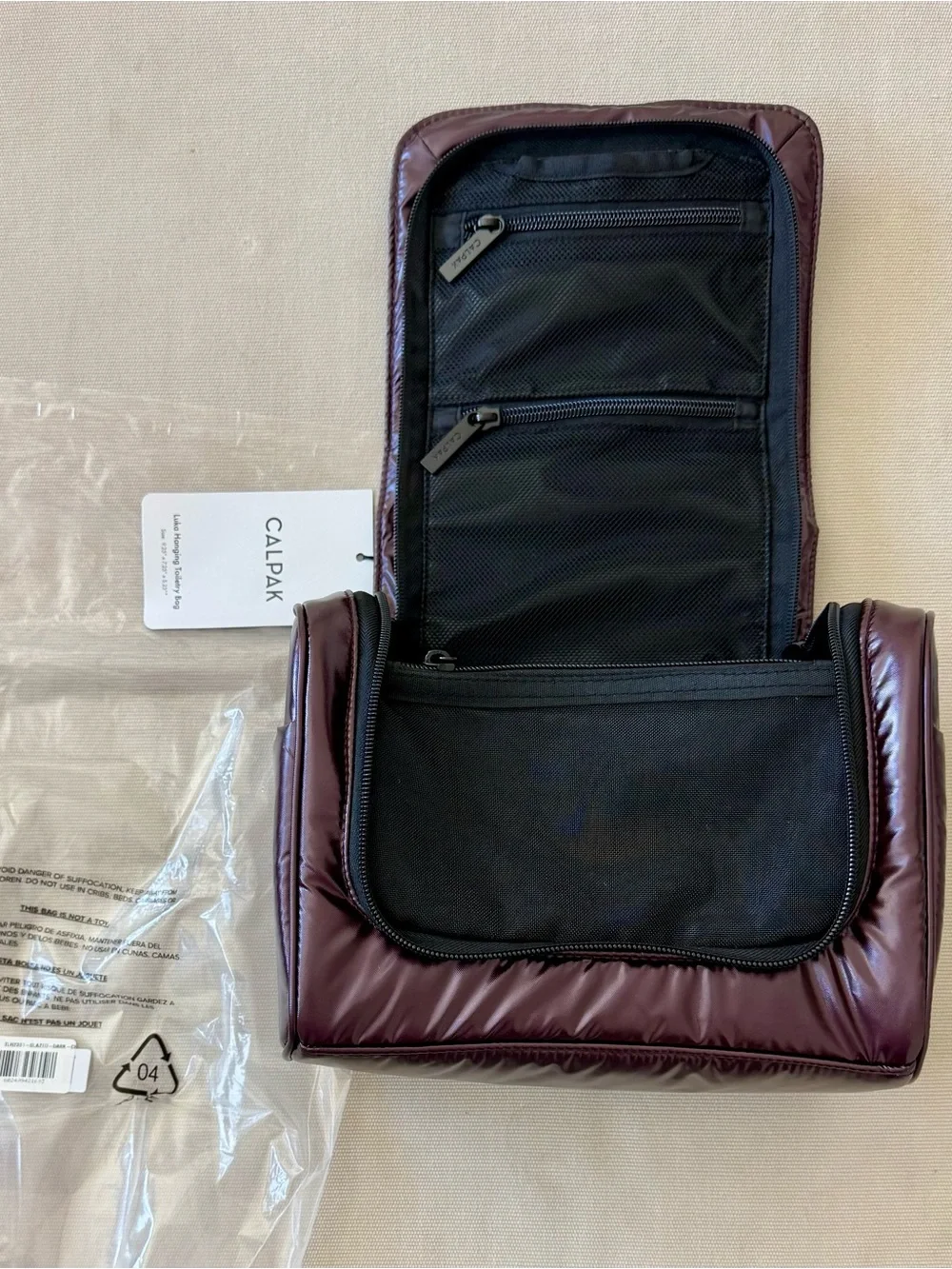 Calpak Luka Hanging Toiletry Bag in Glazed Dark Cherry!